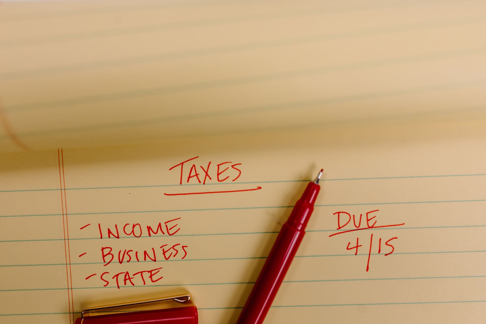 A handwritten plan of income, business, and state taxes